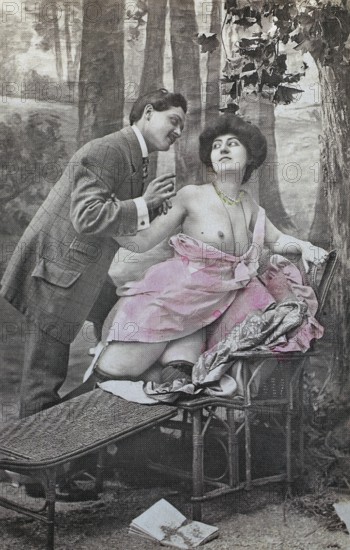 Female nude from around 1899, erotic postcard, playgirl, man striving for woman on a bench in a forest, both in vintage clothing, coloured, reproduction from a photo around the turn of the century, historical, digitally restored reproduction of an old original, exact date unknown