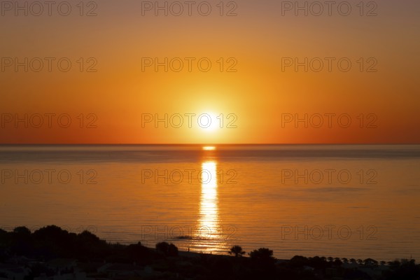 The sun rises on the Costa Rei, a stretch of coastline on the Italian Mediterranean island of Sardinia, Monte Nai, Costa Rei, Sardinia, Italy
