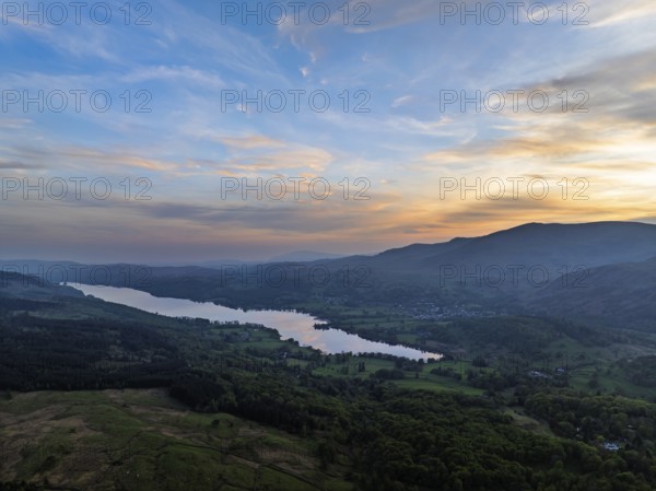 Sunset over Mountains and Coniston Water from drone, Lake District National Park, Cumbria, England, United Kingdom