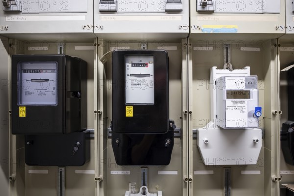 Various rotary electricity meters in a control cabinet in Wuppertal, Germany, digitally reworked