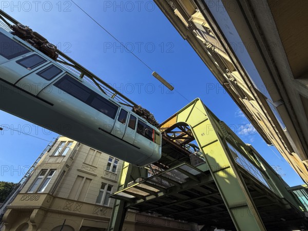 The Wuppertal suspension railway arrives at the Sonnborn stop, Wuppertal, Germany