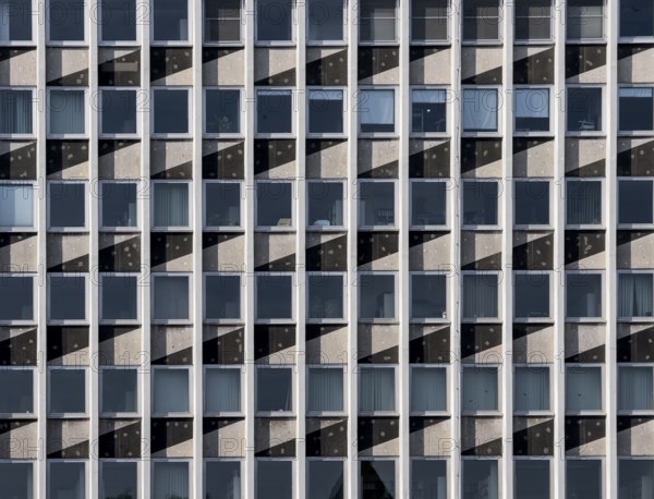 Facade of the Barmen tax office with geometric pattern and serial window structure, Wuppertal, Germany