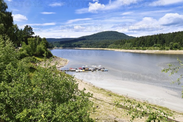 Schwarzenbach (German: Schwarzenbachtal) reservoir in Forbach in the Northern Black Forest in Germany with boat dock and rental on a sunny summer day