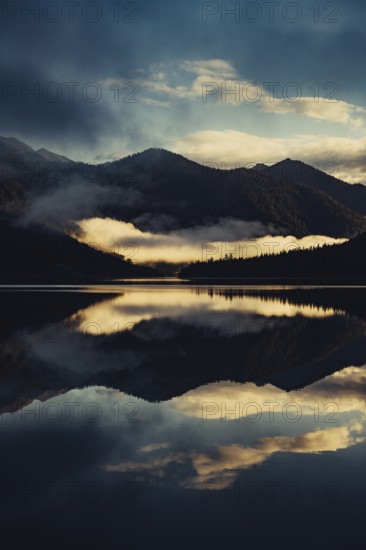 Sunrise with reflections in the Plansee in Tyrol in the Alps in Austria