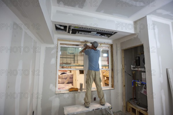 Romulus, Michigan - Workers build apartments in Ginosko Modular 's factory using modular construction methods. The units will be assembled into an apartment building in Detroit for low to moderate income households