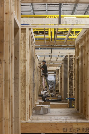 Romulus, Michigan - Workers build apartments in Ginosko Modular 's factory using modular construction methods. The units will be assembled into an apartment building in Detroit for low to moderate income households