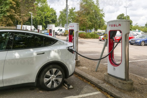 Charging point facility for Tesla electric vehicles at service station, M25 South Mimms services, Hertfordshire, England, UK