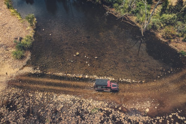 Landrover crosses river in Australian outback in the Kimberley, North West Australia, Australia