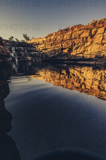 Bell Gorge waterfall, a body of water in north-west Australia in the Kimberley. Sunrise in the outback, Australia