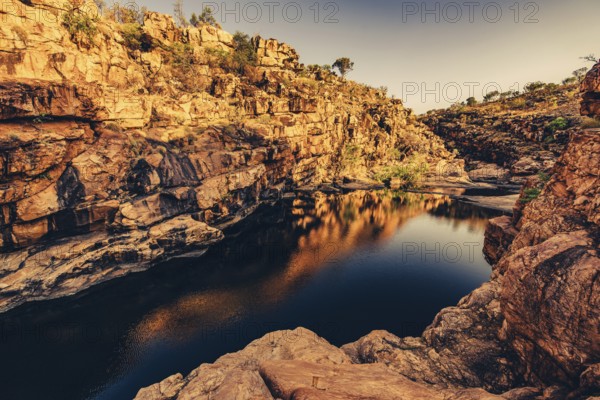 Bell Gorge waterfall, a body of water in north-west Australia in the Kimberley. Sunrise in the outback, Australia