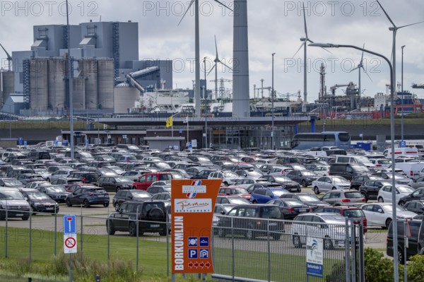Car park at the ferry port of Eemshaven, in the Ems estuary ferry to the German North Sea island of Borkum, by AG Ems Nederland B.V., Borkumlijn, short and long-term car park, industrial port, power plants, wind farm, Netherlands