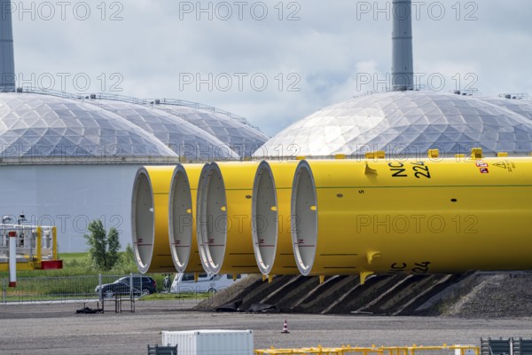 The seaport of Eemshaven, Julianahaven Basin, where the foundation structures, monopiles, for offshore wind farms are stored, which then support the actual wind turbines, the components are transported to the wind farms in the North Sea on large workboats and anchored to the seabed, where the wind turbines are then built, Eemshaven, Netherlands