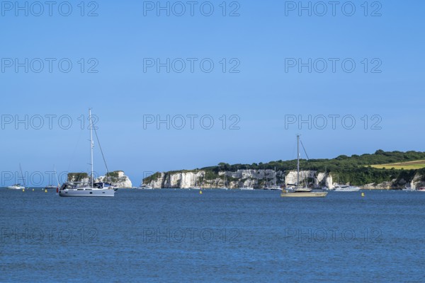 Boats on sea over Knoll Beach Studland, Poole, Dorset, England, United Kingdom