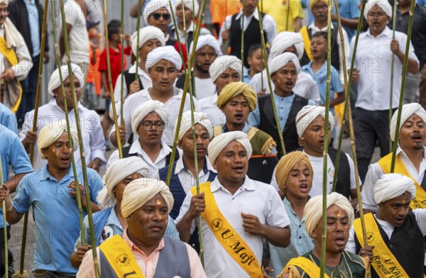 People from the Pnar community attend the Behdienkhlam festival in Jowai, India on July 14, 2025. Behdienkhlam is a vibrant annual festival celebrated by the Pnar (Jaintia) community of Meghalaya, especially in Jowai, to drive away plague and diseases and to pray for a good harvest. Observed in July after the sowing season, it features traditional rituals, offerings to ancestral spirits, and the grand procession of beautifully decorated bamboo structures called rots, which are later immersed in a sacred muddy pool known as Ka Aitnar