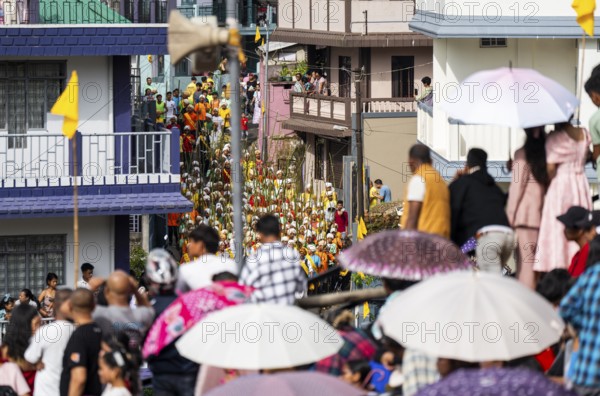 JOWAI, INDIA - JULY 14: People from the Pnar community attend the Behdienkhlam festival in Jowai, India on July 14, 2025. Behdienkhlam is a vibrant annual festival celebrated by the Pnar (Jaintia) community of Meghalaya, especially in Jowai, to drive away plague and diseases and to pray for a good harvest. Observed in July after the sowing season, it features traditional rituals, offerings to ancestral spirits, and the grand procession of beautifully decorated bamboo structures called rots, which are later immersed in a sacred muddy pool known as Ka Aitnar