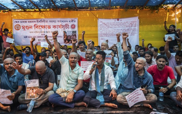 Drivers affiliated with Ola, Uber, and Rapido, under the banner of the Assam State Drivers' Union and the All Assam Cab Welfare Federation, shaved their heads in protest in Guwahati, India, on July 22, 2025. The demonstration held to highlight their demands for fair fare rates, regulation of aggregator commissions, and access to social security and welfare benefits