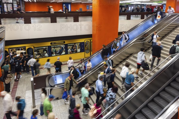 Light rail stop at Stuttgart main station. Platform with many people. Motion blur. Stuttgart, Baden-Württemberg, Germany