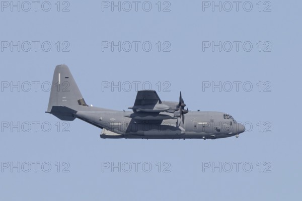 A Lockheed Martin MC-130J Commando II, a US Air Force military aircraft, flies low over Costa Rei, a coastal area of the Italian Mediterranean island of Sardinia, Monte Nai, Costa Rei, Sardinia, Italy