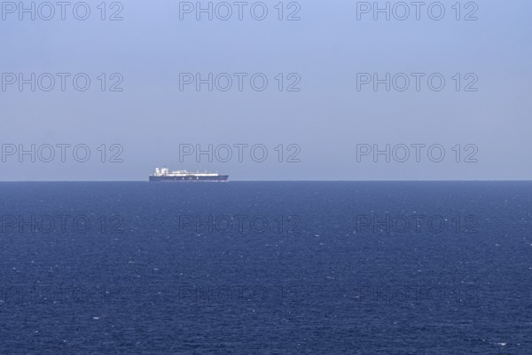 An LNG tanker sails along the Mediterranean Sea off the Costa Rei, a coastal section of the Italian Mediterranean island of Sardinia, Monte Nai, Costa Rei, Sardinia, Italy
