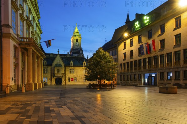 Night shot of Primitial Square with New and Old Town Hall and Primitial Palace in the historic centre of Bratislava, Slovakia