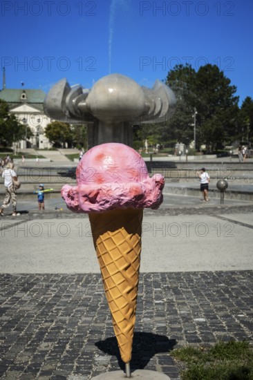 Giant ice cream stand on Freedom Square with a fountain in the shape of a lime blossom in Bratislava, Slovakia
