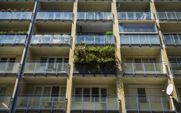 Balcony filled with flowers and plants on an apartment building in the city centre of Bratislava, Slovakia