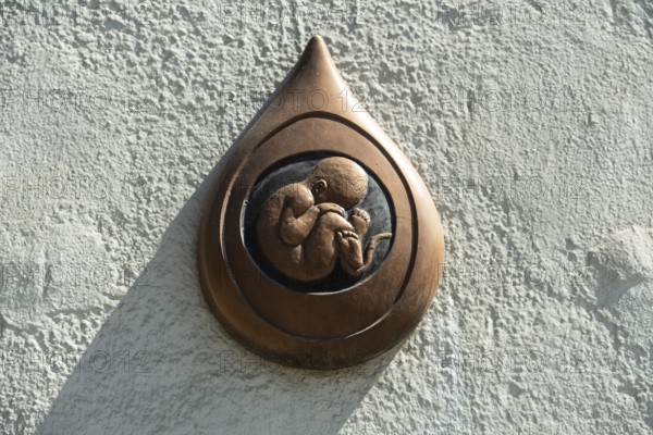 Commemorative picture against abortion on a house in Bratislava, Slovakia
