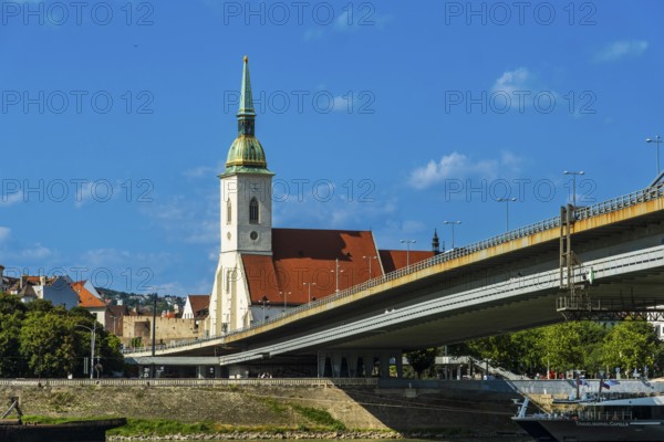 St Martin's Cathedral in Bratislava, in the foreground the Danube and the Bridge of the Slovak National Uprising in Bratislava, Slovakia