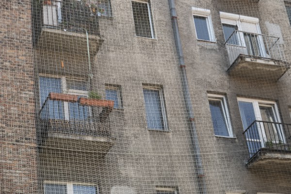 A house with balconies is protected from pigeons with a net, Bratislava, Slovakia