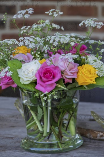 Small bouquet of flowers in a glass jar, Germany