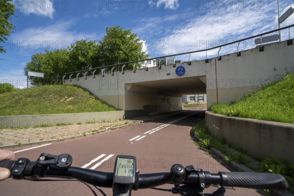 Roundabout in the Dutch city of Houten, the lanes for cars and bicycles are separated, the cycle path runs under the car lane, through subways, so that cyclists and cars can pass the intersection separately, in Houten, bicycle traffic has priority, considered a model city for modern bicycle traffic, Netherlands