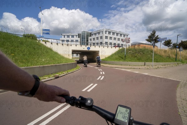 Roundabout in the Dutch city of Houten, the lanes for cars and bicycles are separated, the cycle path runs under the car lane, through subways, so that cyclists and cars can pass the intersection separately, in Houten, bicycle traffic has priority, considered a model city for modern bicycle traffic, Netherlands