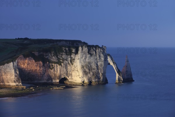Cliffs with the Falaise d'Aval rock gate and the Aiguille d'Etretat rock needle at night, Etretat, Alabaster Coast, Seine-Maritime, Normandy, France