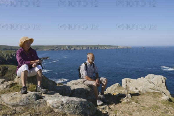 Man and woman on the cliffs, Cap Sizun, Finistere department, Brittany, France