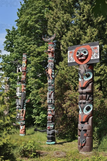 Totem poles, Chief Skedans Mortuary Totem Pole and Ga'akstalas Totem Pole, Stanley Park, Vancouver, British Columbia, Canada