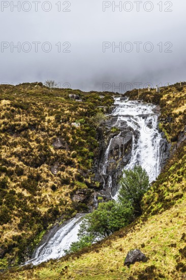 Eas a' Bhradain waterfall, Red Cuillin mountains, Loch Ainort, Isle of Skye, Scotland, UK