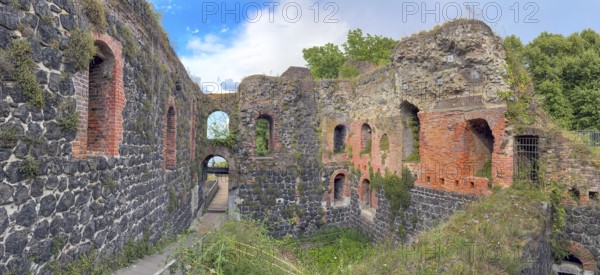 Panoramic photo of interior of northern inner part with partially restored secured masonry of ruins of imperial palace built in the Middle Ages around 1184 on today's banks of the Rhine by Emperor Frederick I Barbarossa, Kaiserswerth, Düsseldorf, North Rhine-Westphalia, Germany