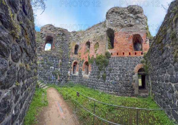 View into the interior of the northern inner part with partially restored secured masonry of the ruins of the imperial palace of Emperor Frederick I Barbarossa, Kaiserswerth, Düsseldorf, North Rhine-Westphalia, Germany, built in the Middle Ages around 1184 on the present banks of the Rhine