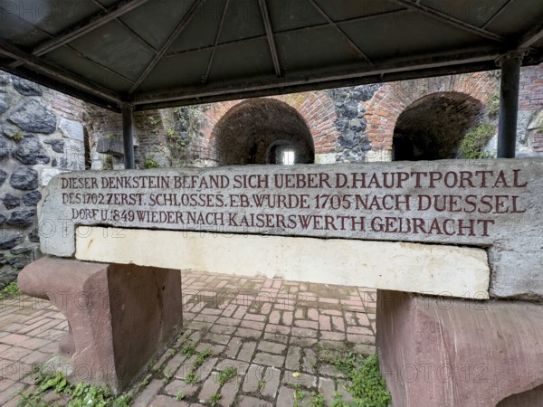 Inscription Explanation Description in modern German language with dates 1705 and 1849 on back of historic lintel lintel over former main portal from the Middle Ages of around 1184 built imperial palace of Emperor Frederick I Barbarossa, Kaiserswerth, Düsseldorf, North Rhine-Westphalia, Germany