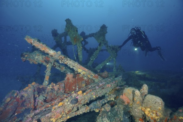 Diver examines the remains of an old shipwreck. Dive site wreck Ville de Grasse, Giens peninsula, Mediterranean Sea, Provence Alpes Côte d'Azur, France