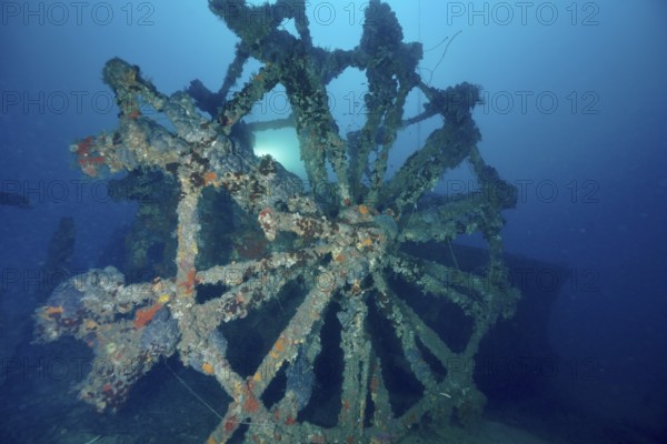 Dilapidated paddle wheel of a shipwreck in blue surroundings. Dive site wreck Ville de Grasse, Giens peninsula, Mediterranean Sea, Provence Alpes Côte d'Azur, France