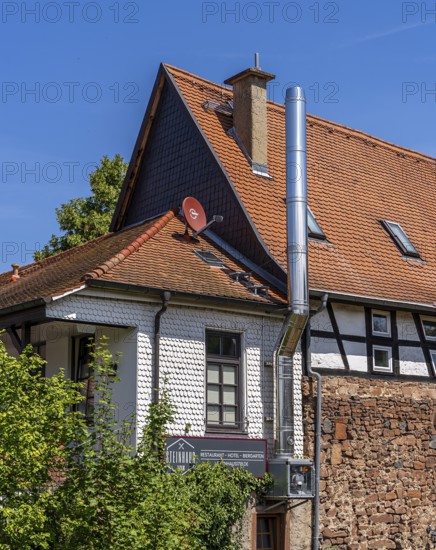 The old town centre with half-timbered houses, church towers and remains of the town wall in Büdingen, Hesse, Germany