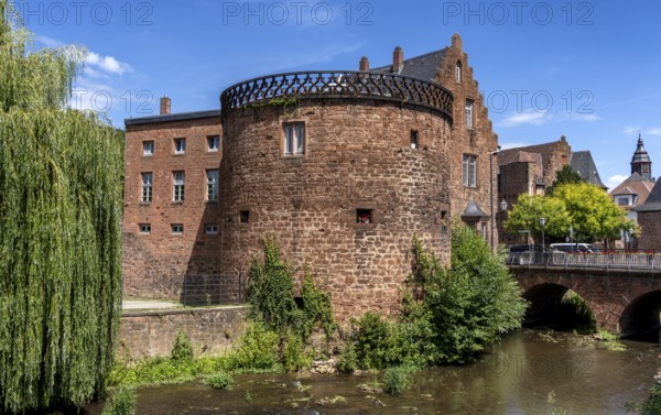 The old town centre with the town wall and the Seemenbach stream, Büdingen, Hesse, Germany