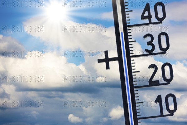 Symbolic image, global warming, thermometer shows high temperatures under a sunny sky with clouds, Baden-Württemberg, Germany