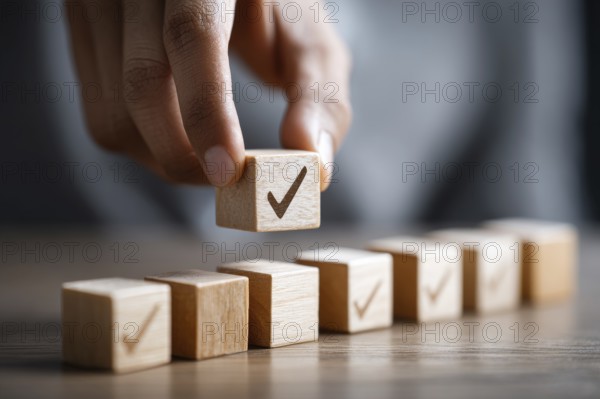 Checklist and task progress tracking concept. A hand placing the final checkmark on wooden blocks in a progress bar, AI generated