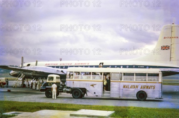 British United Airways (BUA) aeroplane, Bristol Britannia turboprop airliner, Malayan Airways Bus, Singapore, southeast Asia c 1963