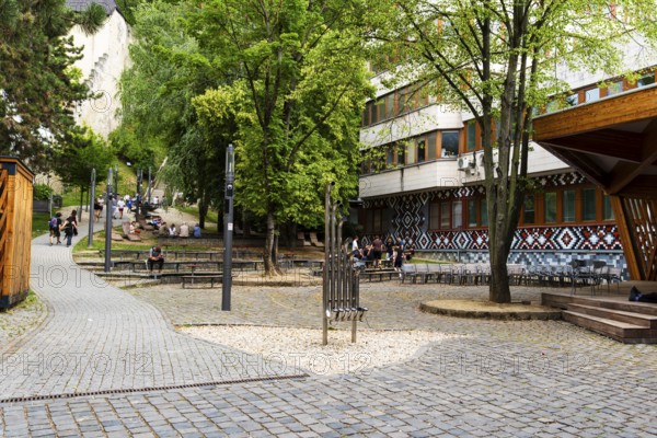 Small park with seating, a playground and a fountain at the entrance to Trencin Castle, Capital of Culture 2026, Trencín, Slovakia