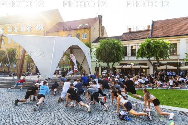 An event by a local fitness centre takes place on a stage on Peace Square, Capital of Culture 2026, Trencín, Slovakia