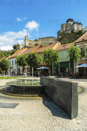 Mark Aurel fountain and fountain on Peace Square with Trencin Bridge in the background, Capital of Culture 2026, Trencín, Slovakia