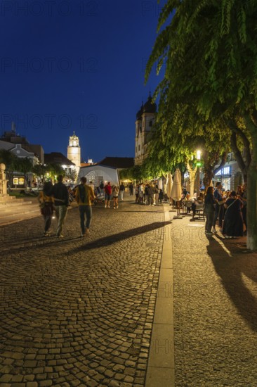 Night shot of the Peace Square in the old town centre of Trencín, in the background the Piarist Church of St. Francis Xavier, Capital of Culture 2026, Trencín, Slovakia